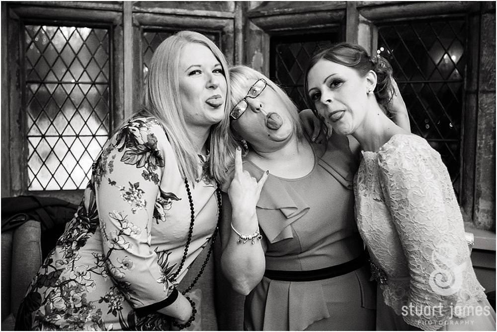 Candid photos as the guests enjoy the wedding reception at Weston Hall in Stafford by Documentary Wedding Photographer Stuart James
