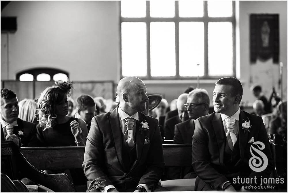Moment between Groom and Best Man captured as they wait for the arrival of the bride