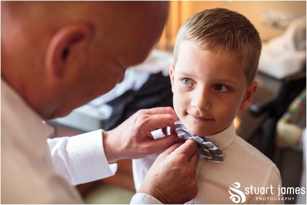 Lovely moment between grandson and grandfather ahead of the wedding ceremony by Chelsea Registry Office Wedding Photographer Stuart James