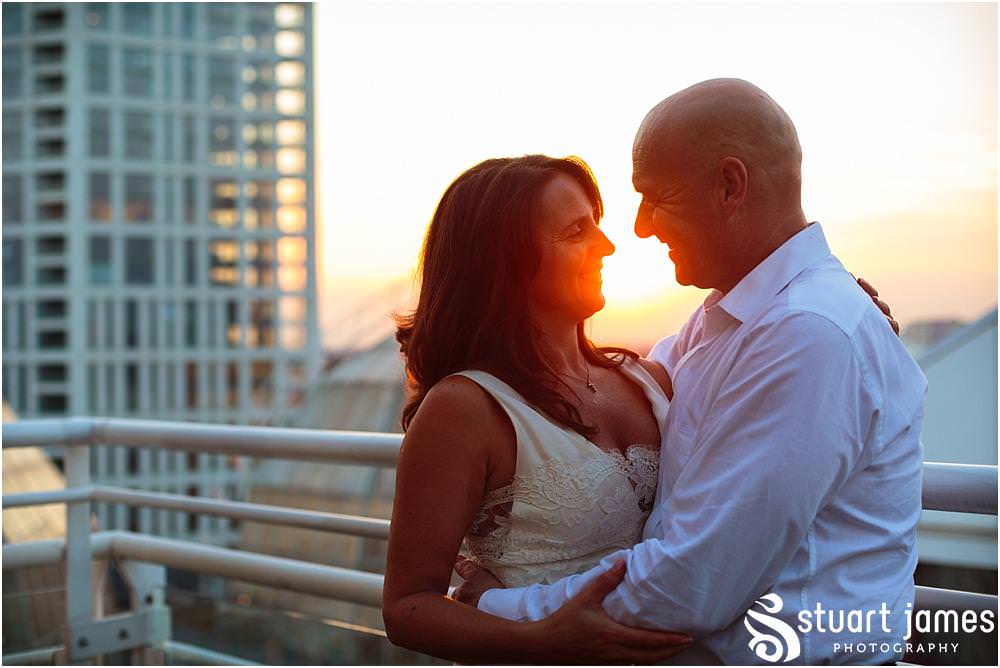 Gorgeous evening portrait as the sun sets on the balcony at Chelsea Harbour Hotel in Chelsea by Documentary Wedding Photographer Stuart James
