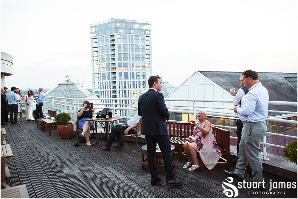 Creative natural photographs capturing the guests enjoying the wonderful setting at Chelsea Harbour Hotel in Chelsea by Documentary Wedding Photographer Stuart James