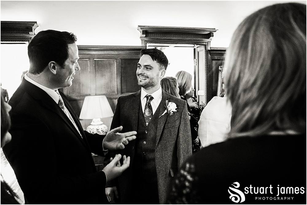 Candid photographs of the guests as they arrive for the wedding at Pendrell Hall in Codsall, Wolverhampton by Pendrell Hall Wedding Photographers Stuart James