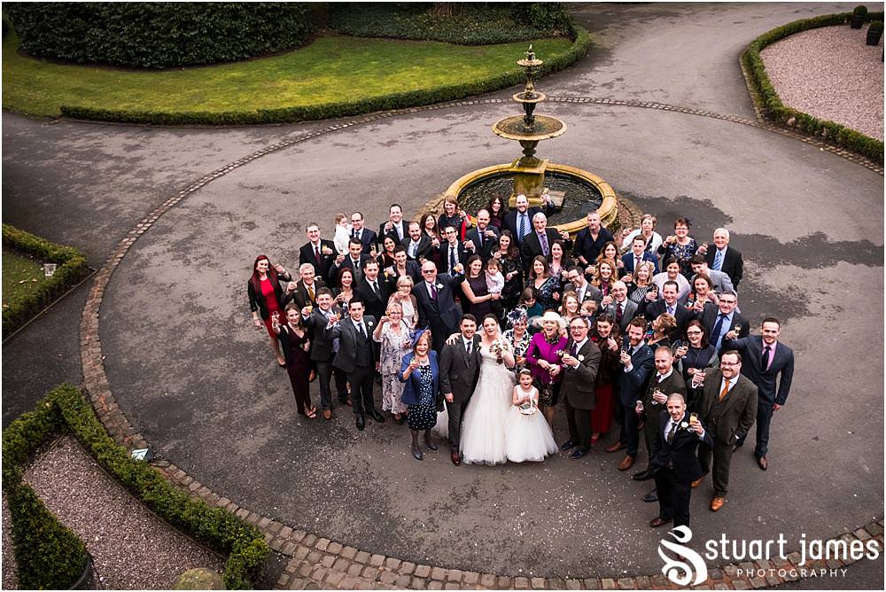 Confetti fun and group photograph at Pendrell Hall in Codsall, Wolverhampton by Pendrell Hall Wedding Photographer Stuart James