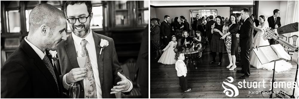 Creative reportage photography of the guests enjoying the drinks reception in the fabulous surroundings of Pendrell Hall in Codsall, Wolverhampton by Pendrell Hall Wedding Photographer Stuart James