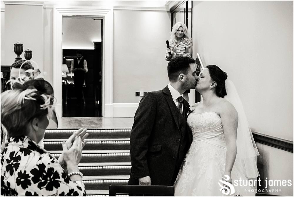 Documenting the fabulous entrance to the wedding breakfast at Pendrell Hall in Codsall, Wolverhampton by Pendrell Hall Wedding Photographer Stuart James