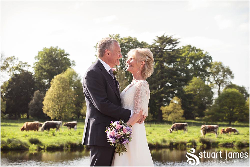 Enjoying the fabulous late spring sunlight whilst exploring the fabulously mature gardens of the Shugborough Estate, creating natural portrait photographs of the Bride and Groom