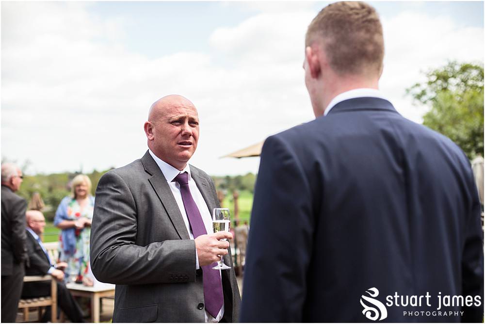 Candid photographs of the guests enjoying the drinks reception on the sun drenched terrace at Weston Hall