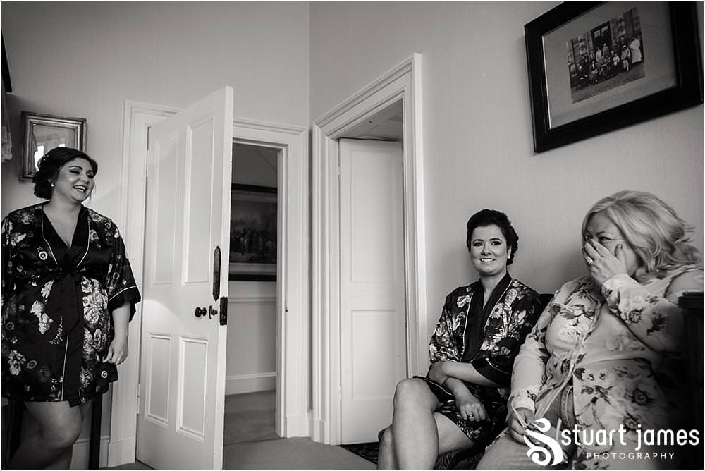 Documenting the morning preparations of the beautiful bride in the bedroom at Sandon Hall in Staffordshire by Documentary Wedding Photographer Stuart James