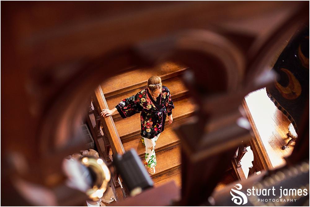 Documenting the morning preparations of the beautiful bride in the bedroom at Sandon Hall in Staffordshire by Documentary Wedding Photographer Stuart James