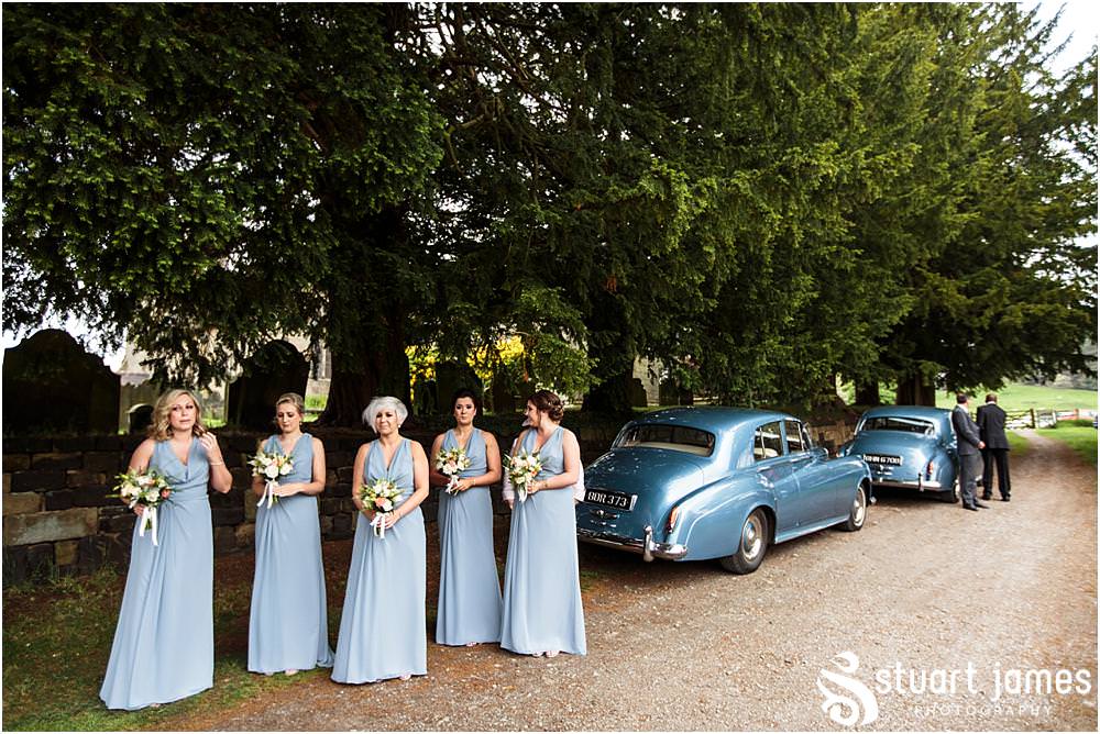Documenting the arrival of the bridal party at All Saints Church in Sandon by Documentary Wedding Photographer Stuart James
