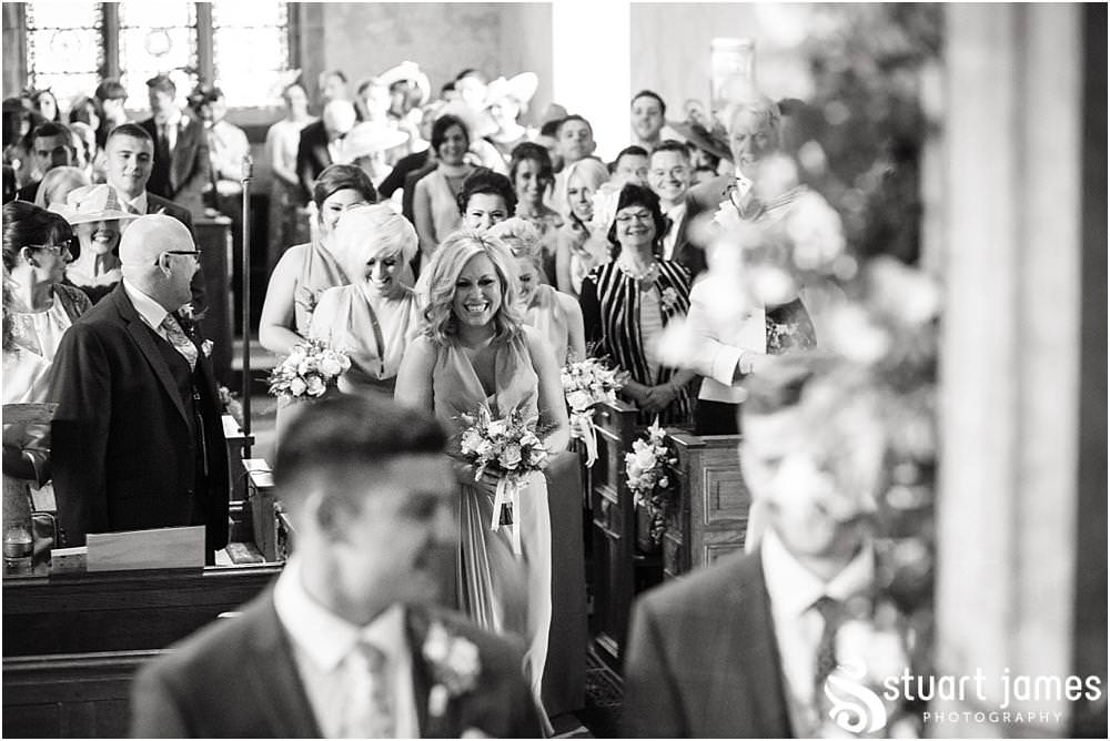 Telling the story of the wedding ceremony with unobtrusive documentary wedding photography at All Saints Church in Sandon by Documentary Wedding Photographer Stuart James