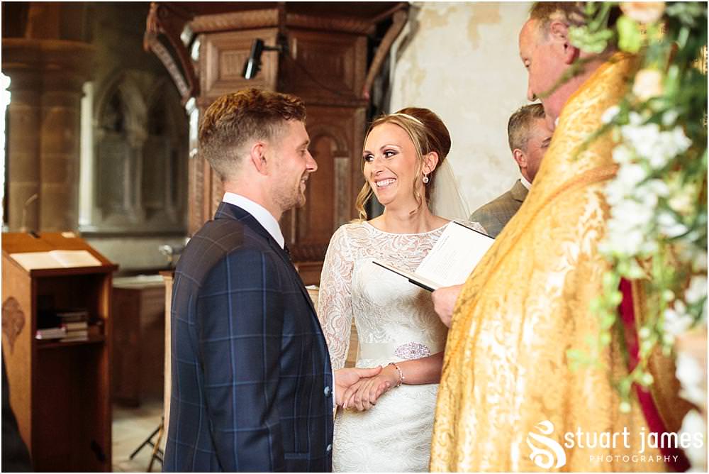 Telling the story of the wedding ceremony with unobtrusive documentary wedding photography at All Saints Church in Sandon by Documentary Wedding Photographer Stuart James
