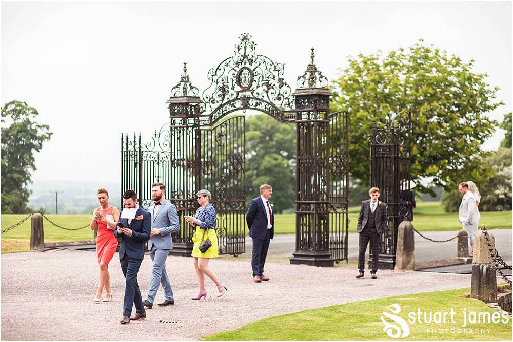 Creative candid photographs of the guests enjoying the drinks reception at Sandon Hall in Stafford by Documentary Wedding Photographer Stuart James