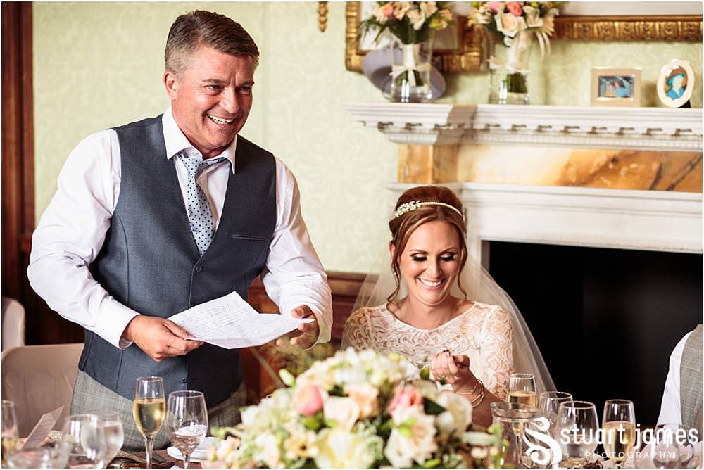 Documenting the Father of the Bride's speech and the fabulous guest reactions at Sandon Hall in Stafford by Documentary Wedding Photographer Stuart James