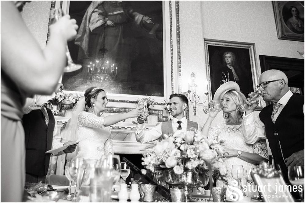 Documenting the Father of the Bride's speech and the fabulous guest reactions at Sandon Hall in Stafford by Documentary Wedding Photographer Stuart James