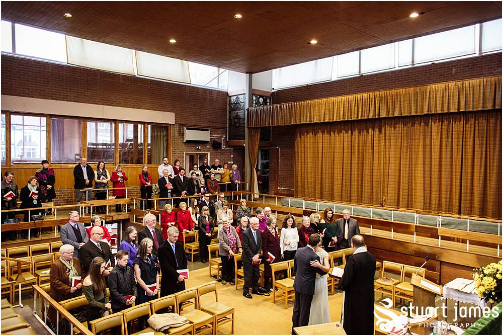 Unobtrusive natural photographs telling the story of the wedding ceremony at Wesley Methodist by West Bromwich West Bromwich Wedding Photographer Stuart James