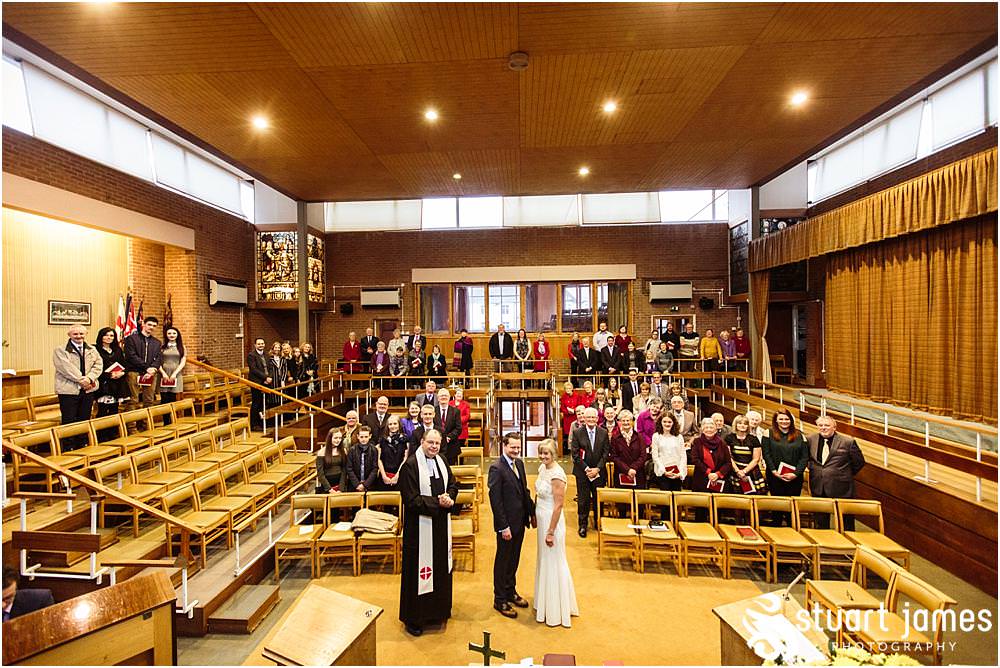 Unobtrusive natural photographs telling the story of the wedding ceremony at Wesley Methodist by West Bromwich West Bromwich Wedding Photographer Stuart James