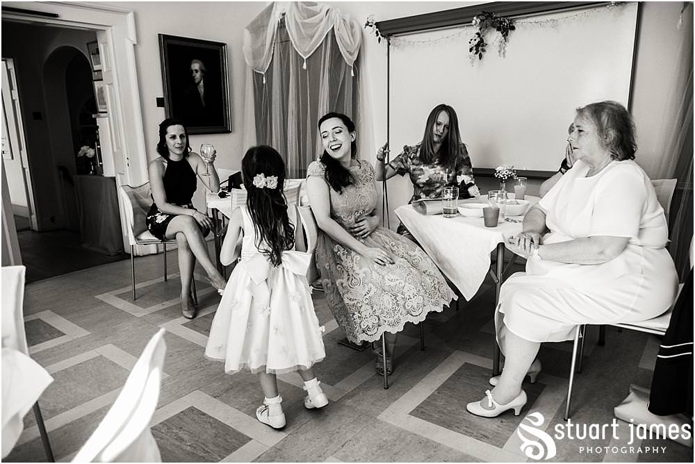 Capturing the wonderful atmosphere of the wedding reception as the guests relax in the gardens and rooms of Erasmus Darwin House in Lichfield by Lichfield Wedding Photographer Stuart James