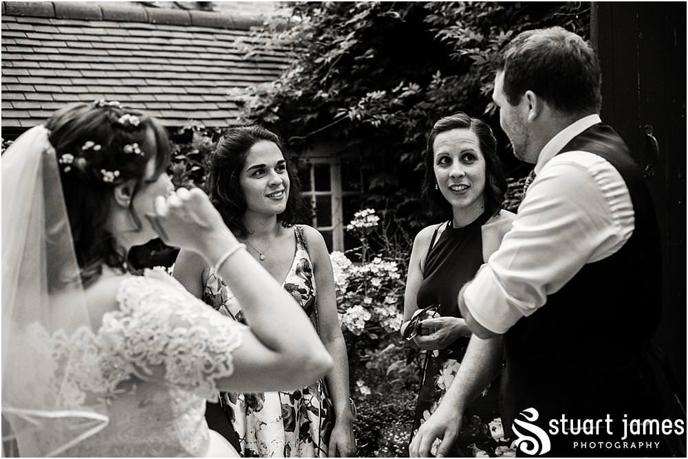 Capturing the wonderful atmosphere of the wedding reception as the guests relax in the gardens and rooms of Erasmus Darwin House in Lichfield by Lichfield Wedding Photographer Stuart James