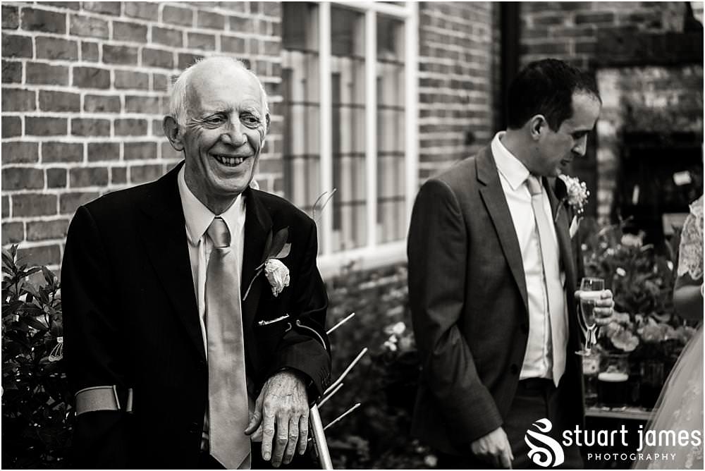 Documenting the wonderful Father of the Bride speech and guest reactions in the gardens of Erasmus Darwin House in Lichfield by Lichfield Wedding Photographer Stuart James