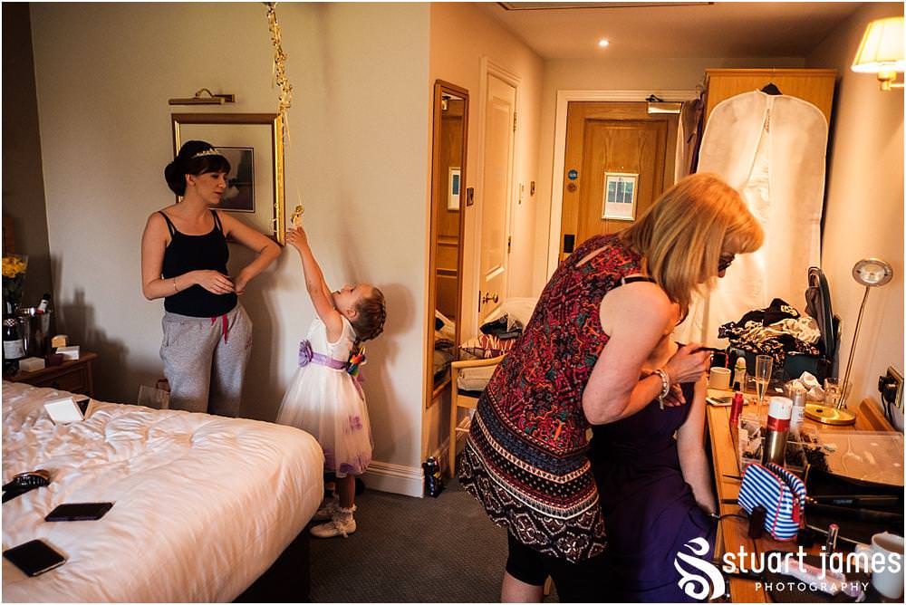 Photos that show the change in mood as the finishing touches are put in place for the wedding at The Moat House in Acton Trussell by Documentary Wedding Photographer Stuart James