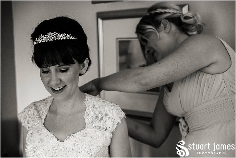 Photos that show the change in mood as the finishing touches are put in place for the wedding at The Moat House in Acton Trussell by Documentary Wedding Photographer Stuart James
