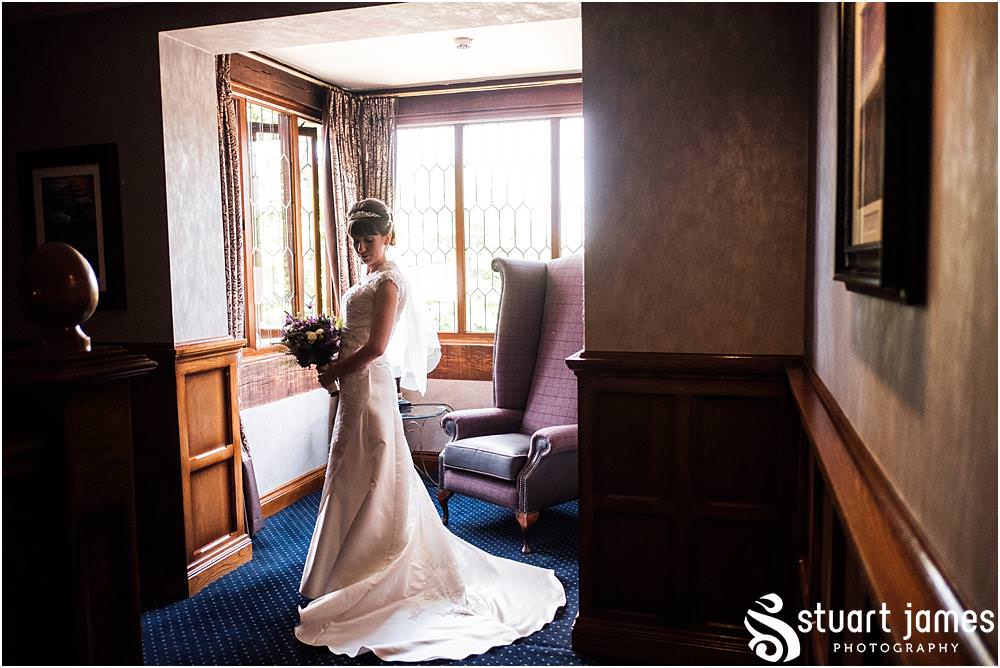 Elegant bridal portrait on the landing at The Moat House in Acton Trussell by Documentary Wedding Photographer Stuart James