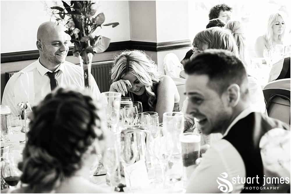 Reportage photographs of the guests enjoying the wedding breakfast at The Moat House in Acton Trussell by Documentary Wedding Photographer Stuart James