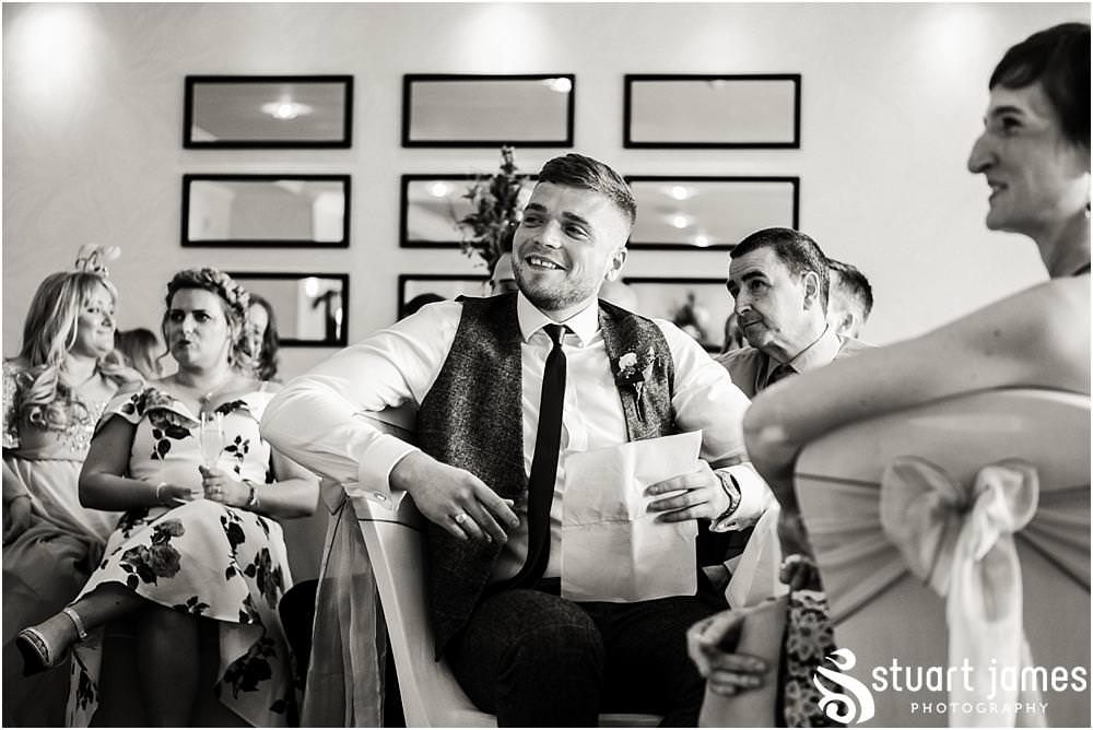 Capturing the emotion and entertainment of the Grooms speech at The Moat House in Acton Trussell by Documentary Wedding Photographer Stuart James