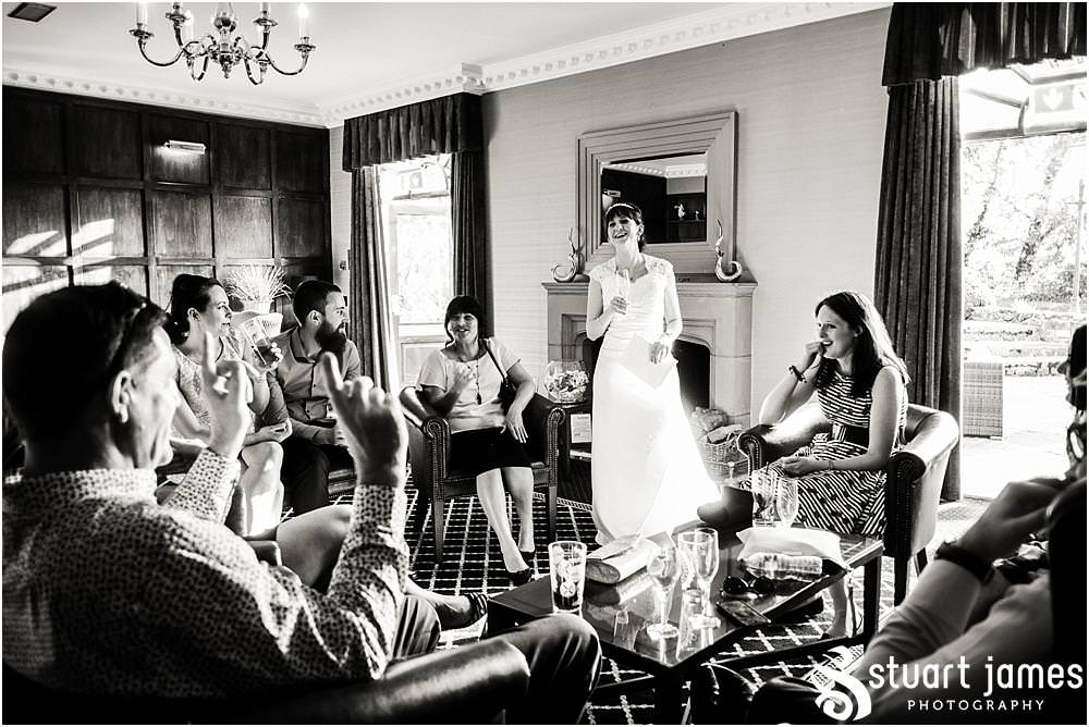 Photos capturing the guests enjoying the wedding reception in the beautiful grounds of The Moat House in Acton Trussell by Documentary Wedding Photographer Stuart James