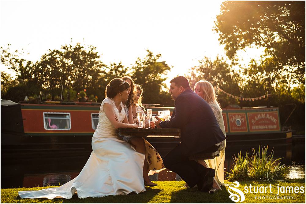 Photos capturing the guests enjoying the wedding reception in the beautiful grounds of The Moat House in Acton Trussell by Documentary Wedding Photographer Stuart James