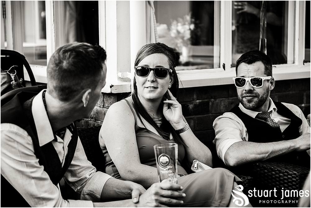 Fun photos showing the life and style of the party at The Moat House in Acton Trussell by Documentary Wedding Photographer Stuart James