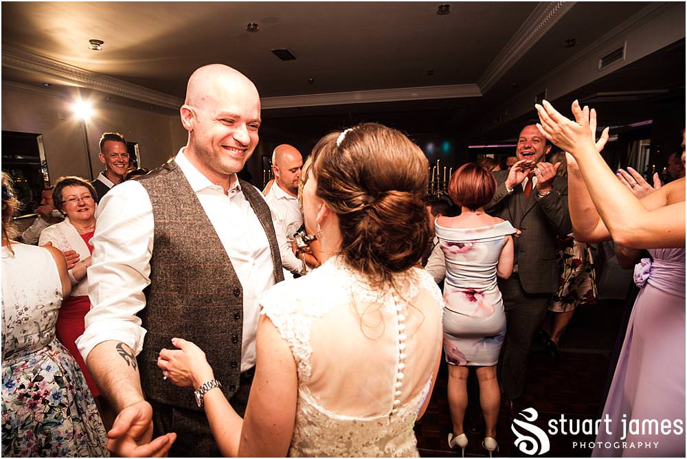 Creative photos of the first dance at The Moat House in Acton Trussell by Documentary Wedding Photographer Stuart James