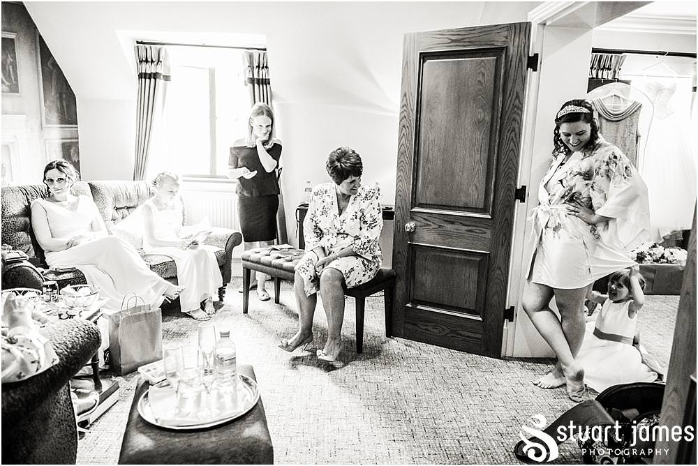 Unobtrusive storytelling photographs of the bridal hair and makeup at The Moat House in Acton Trussell by Penkridge Wedding Photographer Stuart James