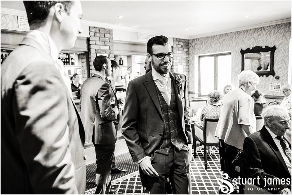 Candid photographs of the guests enjoying the setting of The Moat House in Acton Trussell by Penkridge Wedding Photographer Stuart James