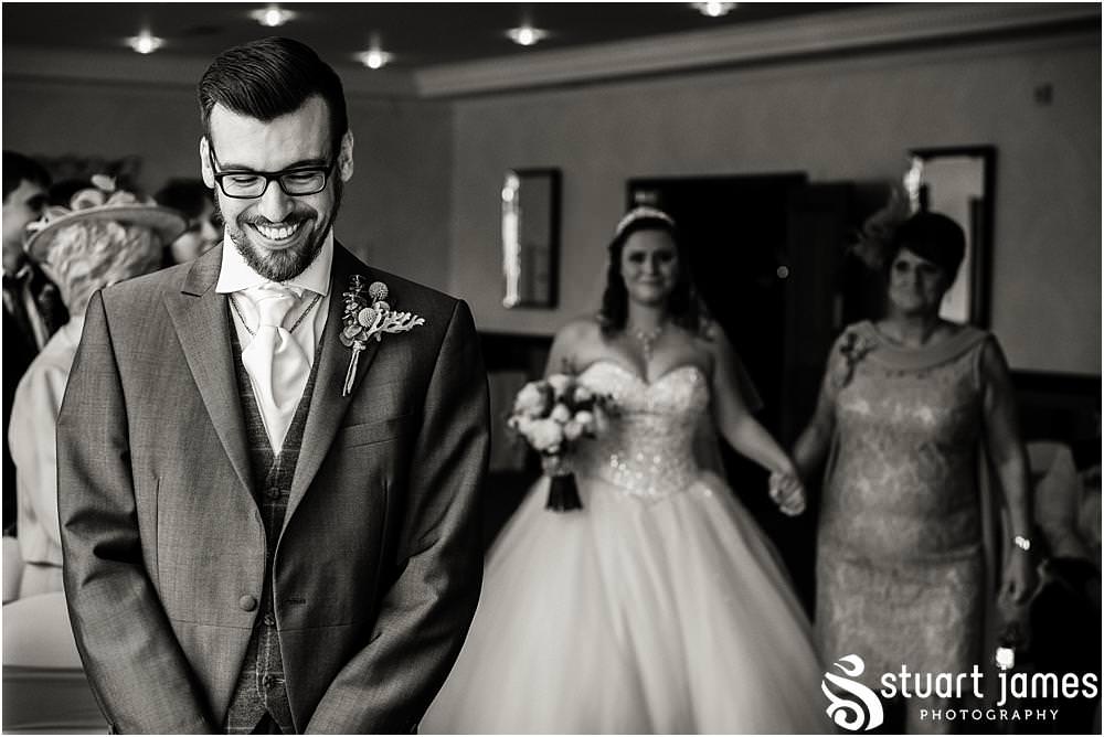 Capturing the beautiful entrance of the bride at The Moat House in Acton Trussell by Penkridge Wedding Photographer Stuart James