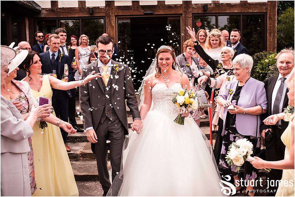 Confetti fun at The Moat House in Acton Trussell by Penkridge Wedding Photographer Stuart James