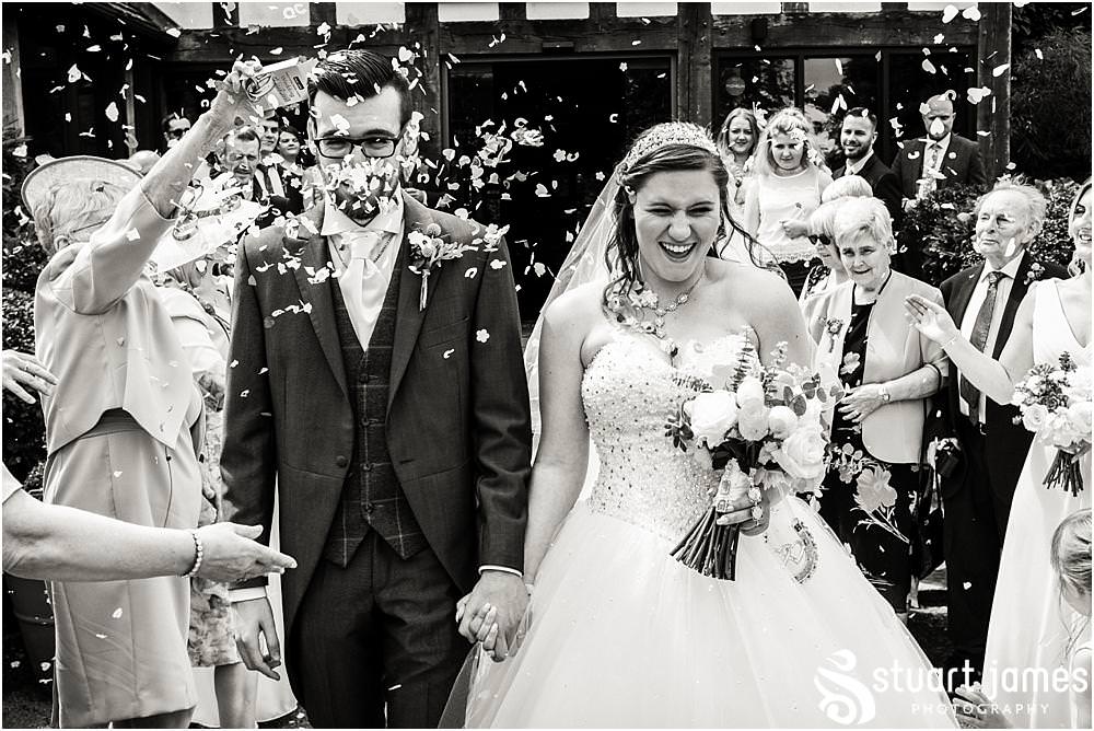 Confetti fun at The Moat House in Acton Trussell by Penkridge Wedding Photographer Stuart James