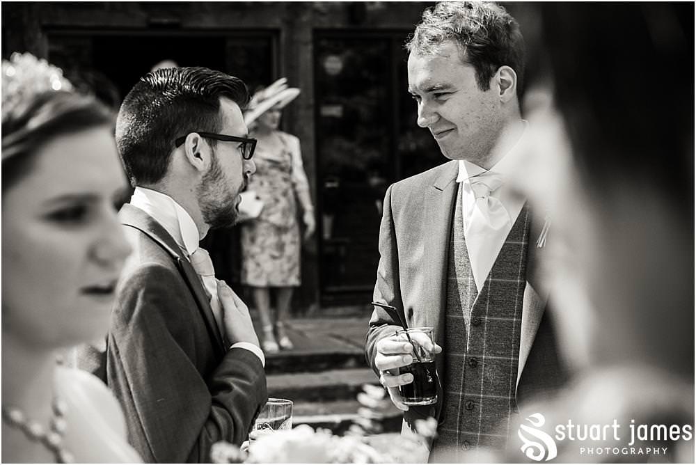 Candid photos as the guests enjoy the drinks reception at The Moat House in Acton Trussell captured by Penkridge Wedding Photographer Stuart James