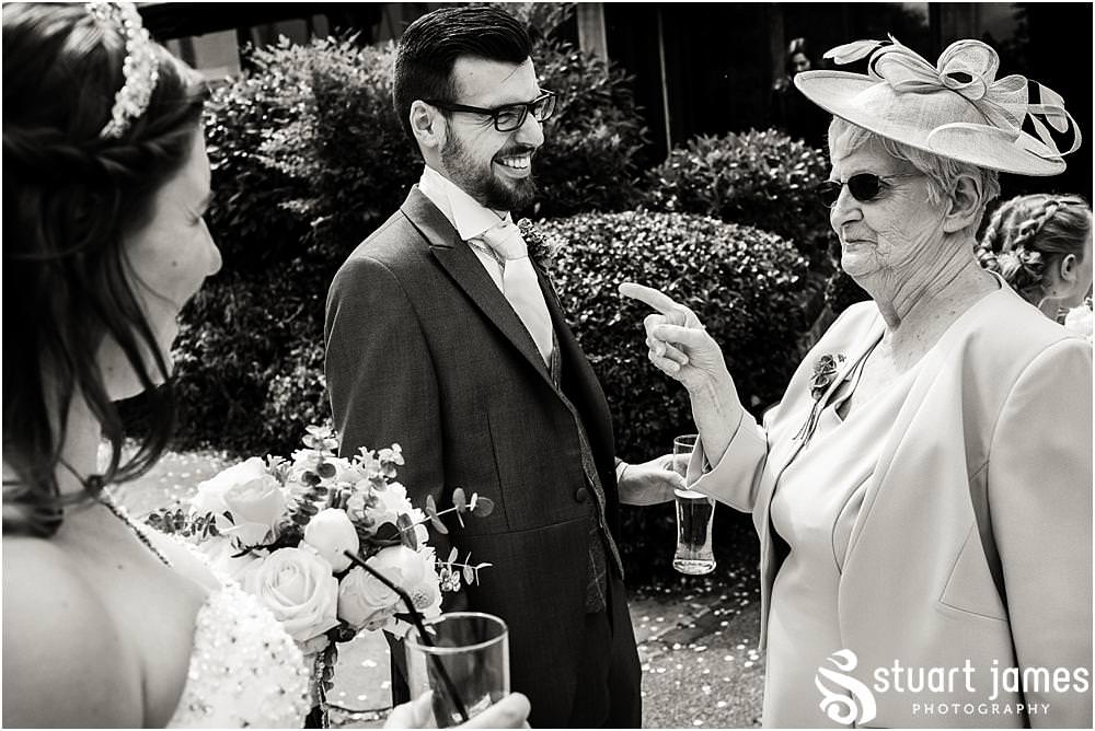 Candid photos as the guests enjoy the drinks reception at The Moat House in Acton Trussell captured by Penkridge Wedding Photographer Stuart James