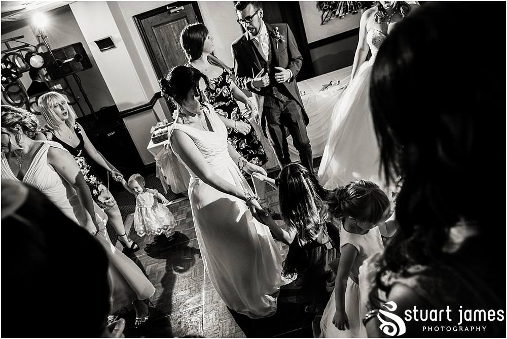 Capturing the fun of the wedding reception as the guests party the night away at The Moat House in Acton Trussell captured by Penkridge Wedding Photographer Stuart James