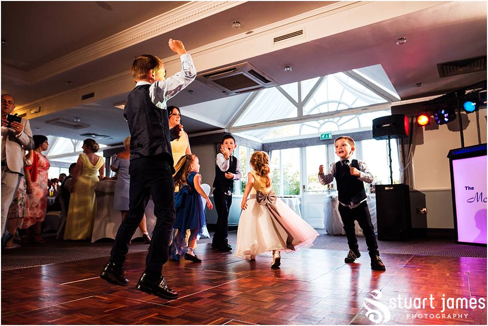 Capturing the fun of the wedding reception as the guests party the night away at The Moat House in Acton Trussell captured by Penkridge Wedding Photographer Stuart James