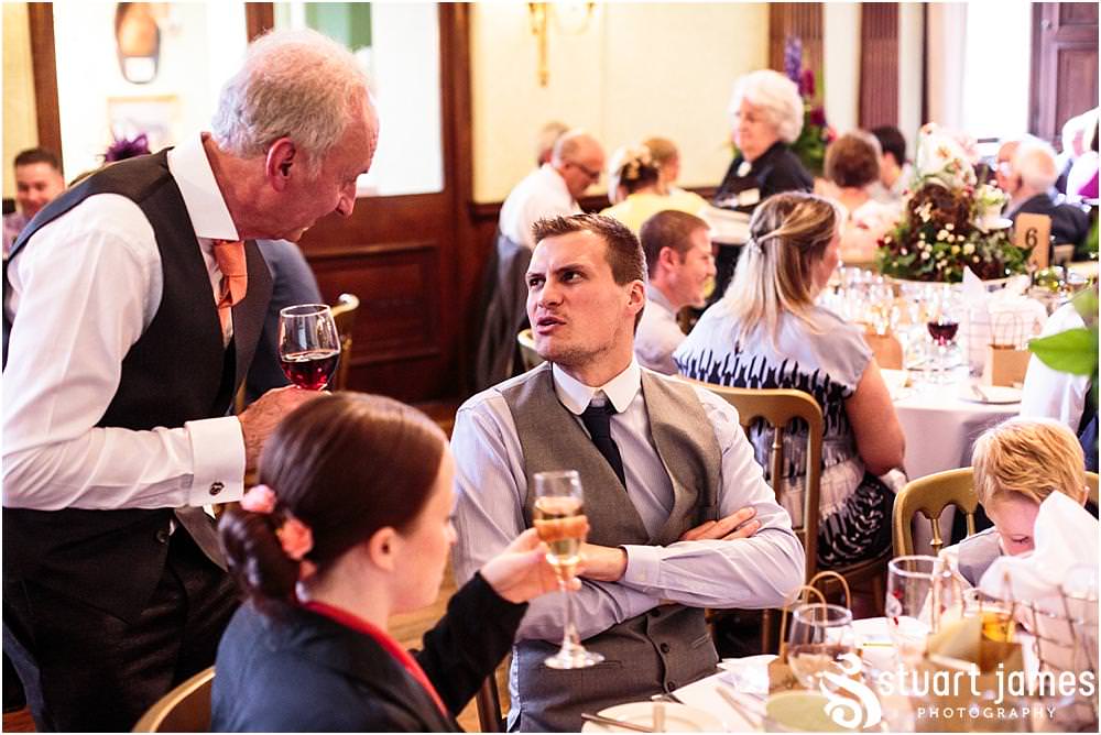 Candid photos of the guests enjoying the wedding breakfast at Sandon in Staffordshire by Documentary Wedding Photographer Stuart James