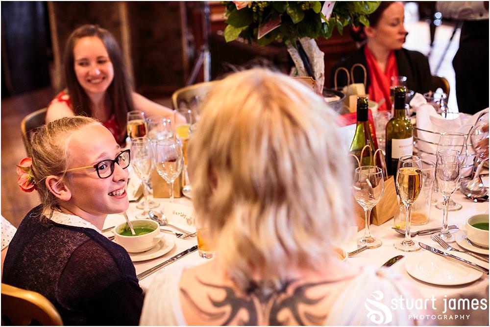 Candid photos of the guests enjoying the wedding breakfast at Sandon in Staffordshire by Documentary Wedding Photographer Stuart James