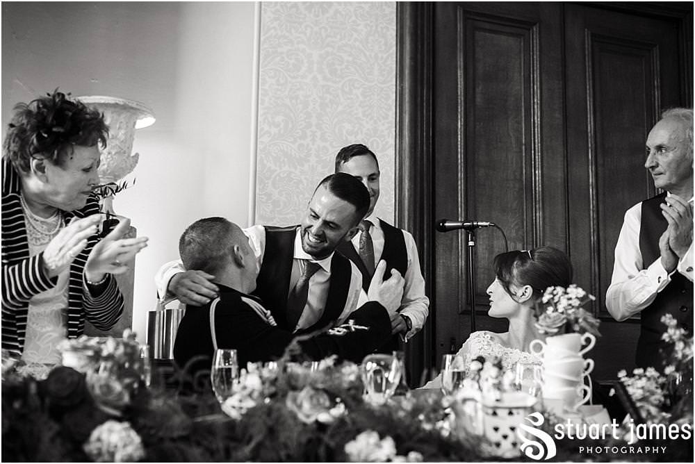 Reportage photographs of the Best Mans speech at Sandon in Staffordshire by Documentary Wedding Photographer Stuart James, showing the wonderful reaction of the guests