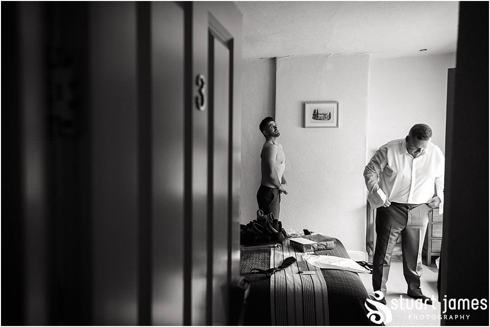 Reportage photographs of the groomsmen preparations before the wedding at Warwick House in Southam by Documentary Wedding Photographer Stuart James