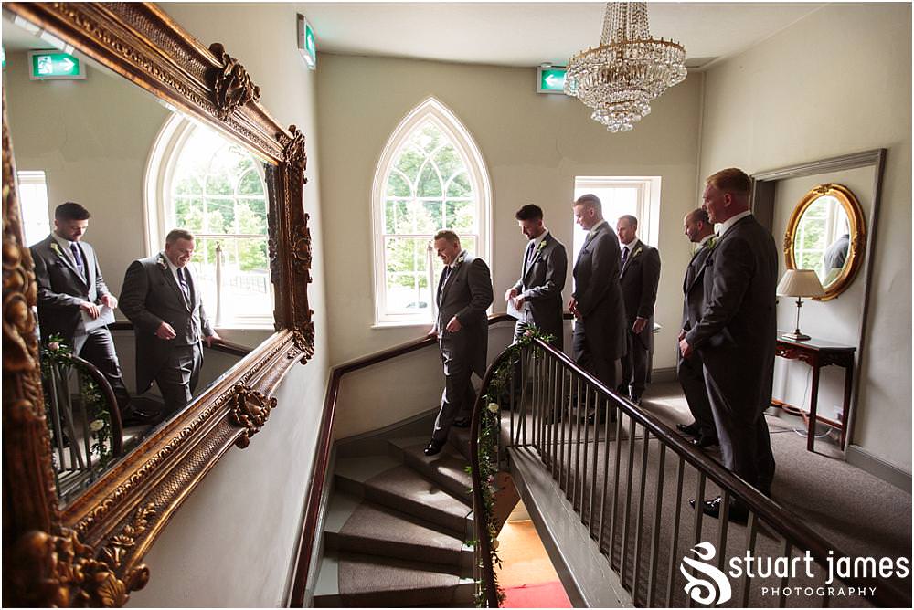 Candid photographs of the groomsmen having a final toast to the day at Warwick House in Southam by Documentary Wedding Photographer Stuart James