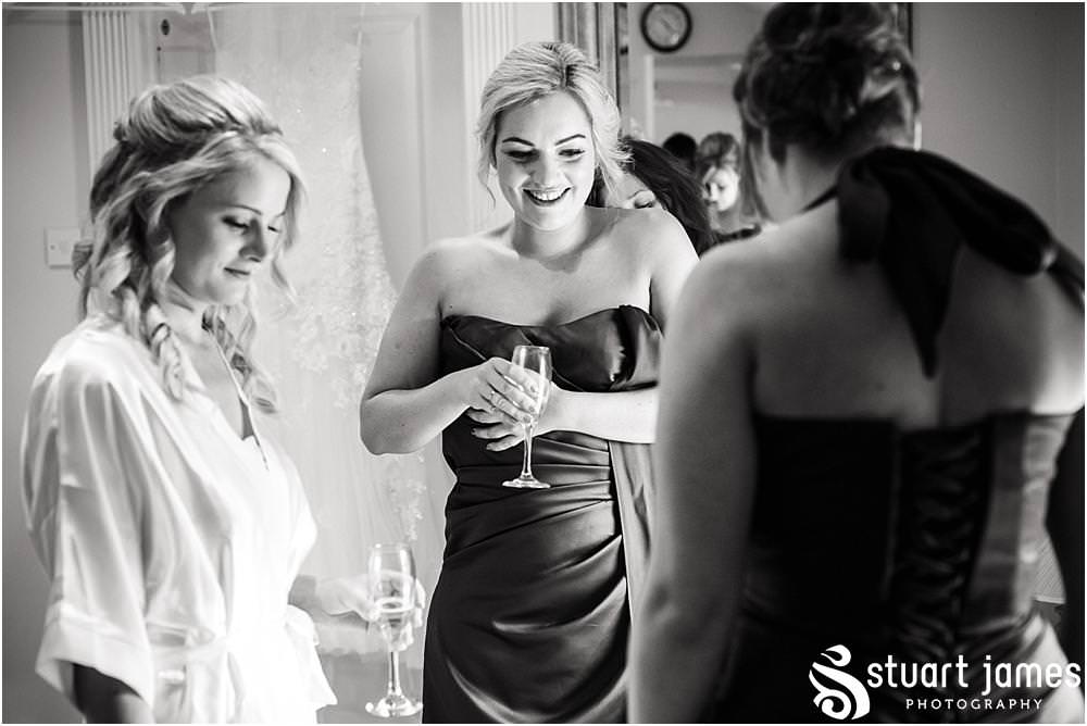 Documenting the bridal preparations as the finishing touches come together for the summer wedding at Warwick House in Southam by Documentary Wedding Photographer Stuart James