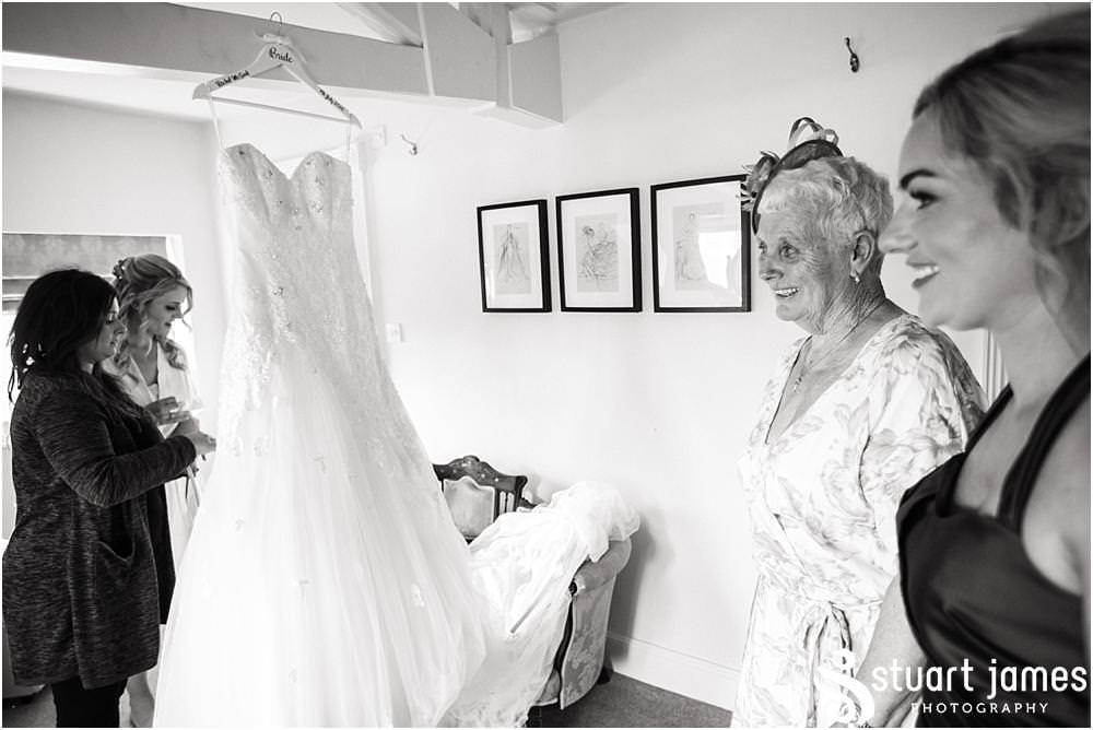 Capturing the emotion as the brides dress and finishing touches come together at Warwick House in Southam by Documentary Wedding Photographer Stuart James