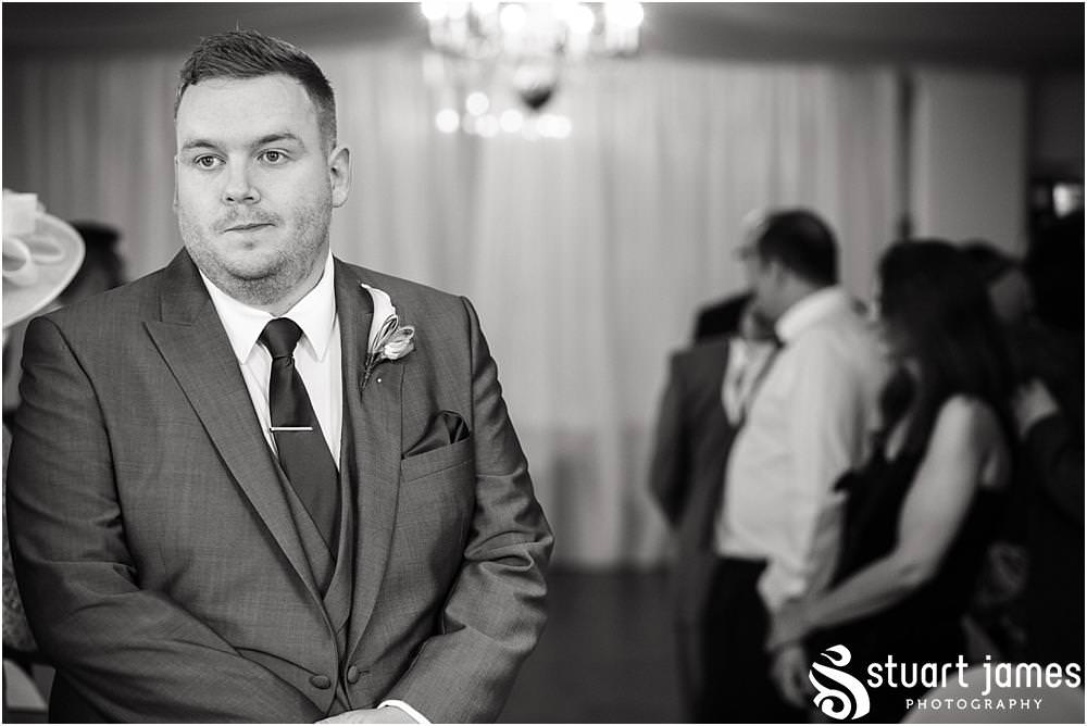 Documenting the entrance of the beautiful bride to the ceremony at Warwick House in Southam by Documentary Wedding Photographer Stuart James